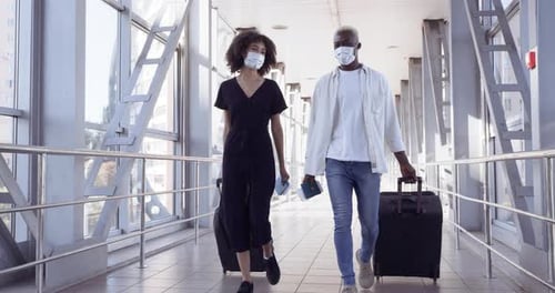 Two Unfamiliar Human Passengers Wear Medical Protective Masks Girl and Guy Meeting at Airport at