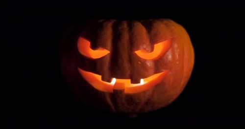 Illuminated Jack-o'-Lantern with Black Background