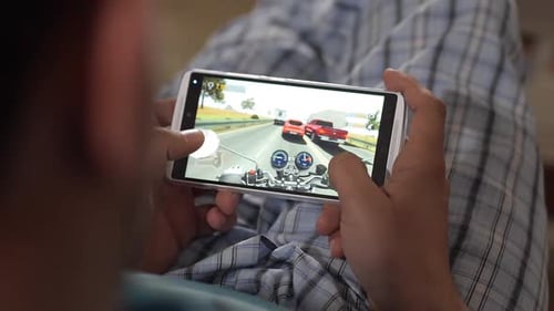 Playing a Racing Game on a Smartphone.