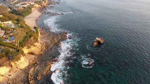 Flying over million dollar beach front luxury homes and a private beach in beautiful Laguna Beach Ca