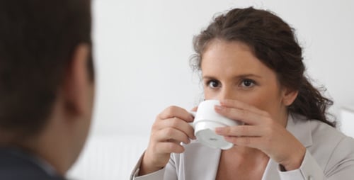 Woman in White Blazer Having Discussion in Office
