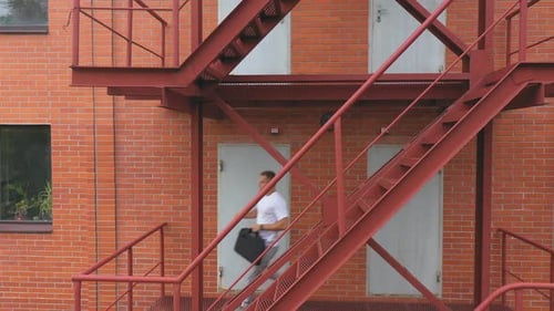 Hurry Young Businessman Running Up on Stair Going to Office