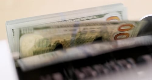 America banknote on automatic counting machine