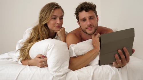 Couple Lying in Bed