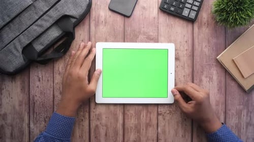 Man's Hand Working on Digital Tablet on Office Desk