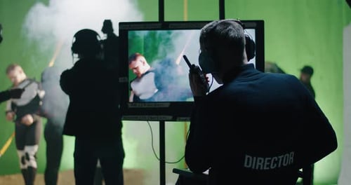 Film Crew Directing Actors on Green Screen Set