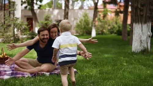 Family Fun: Child Running to Loving Parents