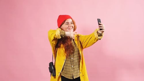 Smiling Woman Waving During Mobile Phone Video Call
