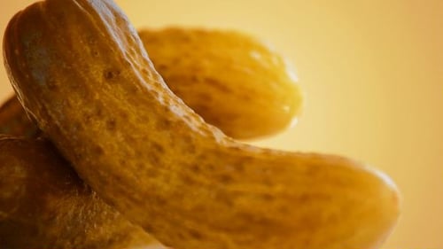Golden Pickles Stacked in Close Up Food Footage