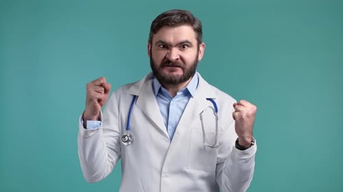 Angry Doctor Gestures and Makes an Angry Face