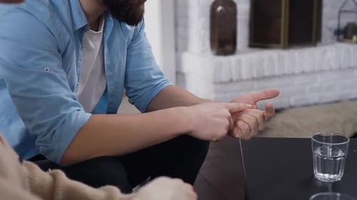 Man Making Calculations on Fingers about Problems with His Disappointing Girlfriend
