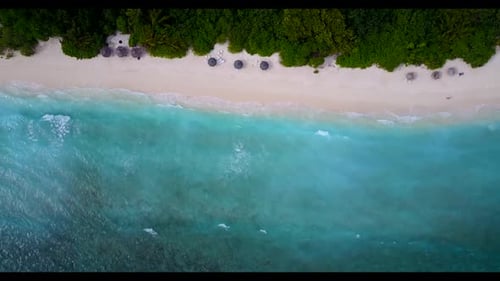 Aerial flying over scenery of idyllic bay beach vacation by turquoise water and white sandy backgrou