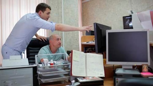 Two Men Are Working in the Office