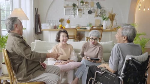 Seniors Laughing and Talking at Home
