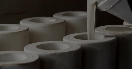 Pouring Clay Into Forms At Pottery Studio