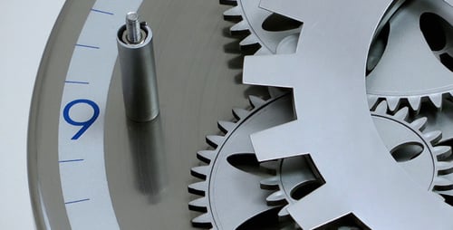 Clock Gears Turning in Close Up Studio Shot