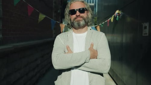 Confident Man Posing in Urban Alleyway