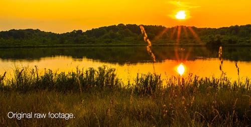 Golden Sunrise Over Peaceful Lake and Grassland