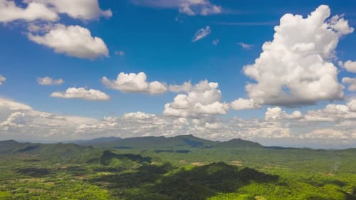 Aerial view, clouds moving over the mountains.
