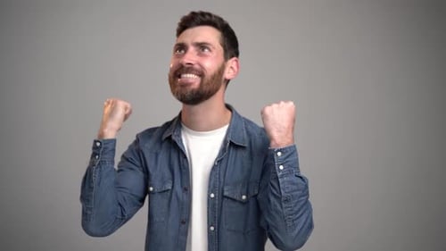 Man Celebrating Good News in Studio with Joy