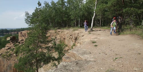Hikers Walking in Rural Setting on Sunny Day