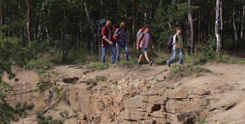 Young Adults Hiking Together in the Forest
