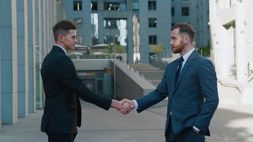 Businessmen Handshake in Urban Financial District