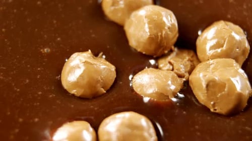 Caramel balls in melted chocolate