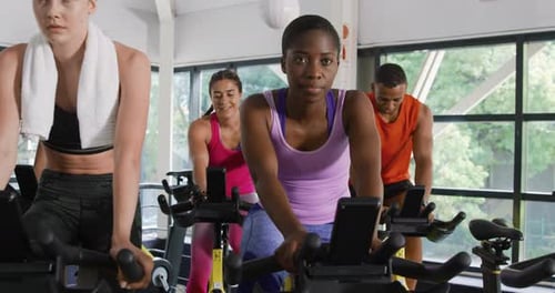 Working out on exercise bikes at a gym