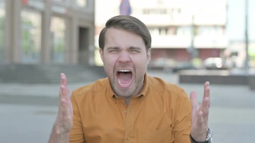 Frustrated Man Yelling Loudly in an Urban Setting