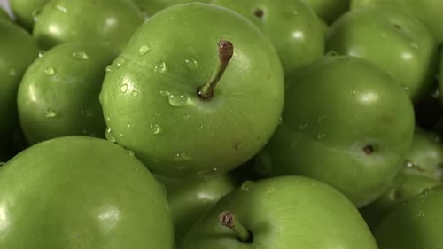 Close Up Pile Of Fresh Green Plum On The Market Counter