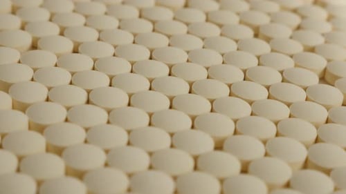 Rows of Small White Pills