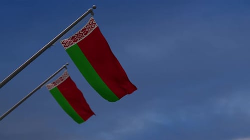 Waving Flag of Belarus Against Blue Sky