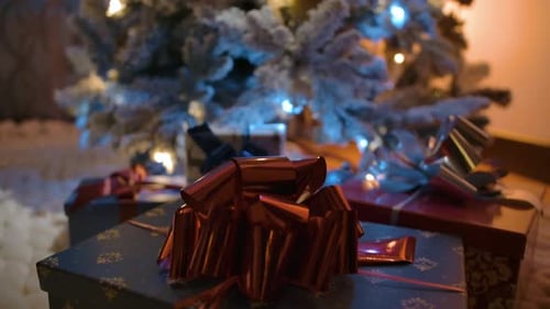Christmas Tree with Presents in Home at Night