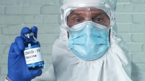Medical Professional Holding COVID-19 Vaccine Vial