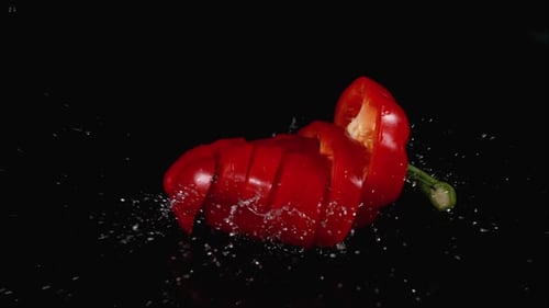 Slicing Red Bell Pepper with Water Droplets