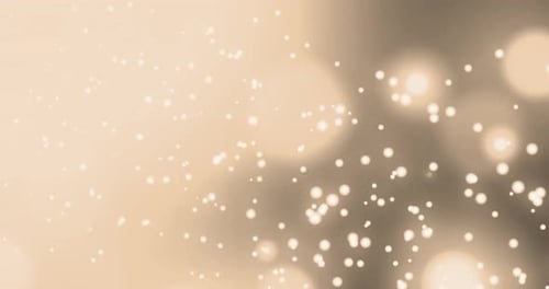 Animation of multiple glowing yellow spots of light moving in hypnotic motion on black background