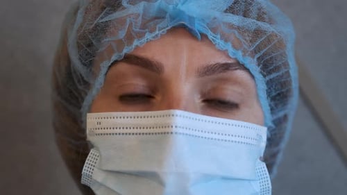 Close Up Doctor or Nurse With Face Mask Preparing Surgery Intervention Medical Clinic