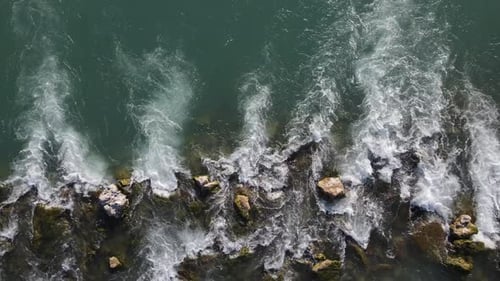 River Flowing Through Stones