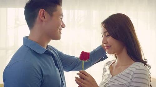 Young Couple with Rose Showing Affection