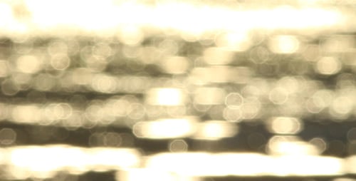 Abstract Water Bokeh Reflecting Golden Light