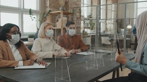Diverse Group Meeting with Face Masks at Workplace