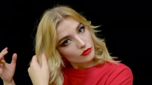 Blonde Woman Posing with Bright Makeup