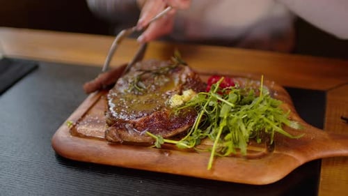 Cutting Delicious Steak Meal at Restaurant