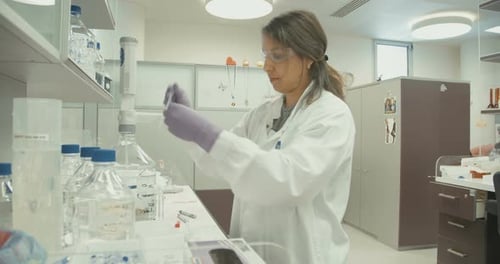 Scientist Conducts Lab Research in Bright Laboratory