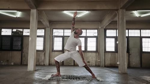 Man Doing Yoga Flow in Urban Loft