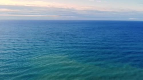 Unbelievable aerial drone flight panorama overview drone shot coastline wave cliff island hills fore