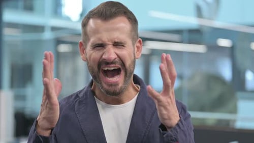 Angry Bearded Man Yelling in Office Close Up