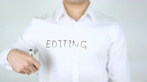 Hand Writing the Word EDITING with Marker