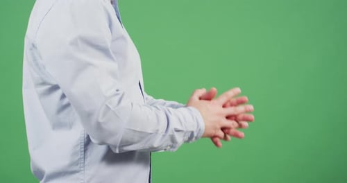 Side view of fingers crossed in prayer